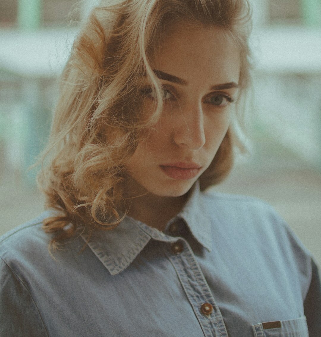 Portrait of a young professional woman with curly hair